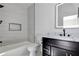 Modern bathroom with tiled shower, sleek vanity, and illuminated mirror offering a luxurious feel at 136 Beutell St, Norcross, GA 30071