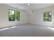 Bright, airy bedroom featuring ample natural light from two windows overlooking the trees at 136 Beutell St, Norcross, GA 30071