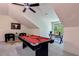 Game room featuring a pool table, fan, a decorative bull painting, and a desk with a window at 136 Beutell St, Norcross, GA 30071