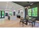 Modern kitchen with a large island, stainless steel appliances, and ample counter space open to the dining area at 136 Beutell St, Norcross, GA 30071