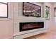 Living room showcasing a modern fireplace with a sleek electric insert and contemporary design at 136 Beutell St, Norcross, GA 30071