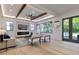 Bright living room featuring modern fireplace, built-ins, sleek furniture, and ample natural light at 136 Beutell St, Norcross, GA 30071