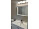 Bathroom with white vanity, modern faucet, toilet, and mirror at 1607 Hillview, Jonesboro, GA 30236