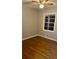 Neutral bedroom with hardwood floors, ceiling fan, and large windows for natural light at 1607 Hillview, Jonesboro, GA 30236