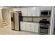 Kitchen with stainless steel appliances, granite countertops, and white cabinets at 1607 Hillview, Jonesboro, GA 30236
