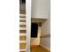 View of the staircase leading to kitchen with stainless steel appliances, and tile flooring at 1607 Hillview, Jonesboro, GA 30236