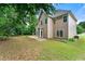 Expansive backyard featuring a deck, lush greenery, and ample space for outdoor activities and relaxation at 2994 Meadow Church Rd, Suwanee, GA 30024