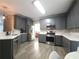 Modern kitchen with stainless steel appliances, subway tile backsplash, and ample counter space at 2994 Meadow Church Rd, Suwanee, GA 30024