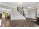 Elegant entryway boasting hardwood floors, staircase, and chandelier lighting at 2994 Meadow Church Rd, Suwanee, GA 30024