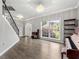 Bright foyer with hardwood floors, chandelier, and large window overlooking the front yard at 2994 Meadow Church Rd, Suwanee, GA 30024