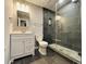 Stylishly renovated bathroom with a tiled shower, modern vanity, and sleek fixtures at 3784 The Great Dr, Atlanta, GA 30349