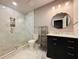 Bright bathroom featuring a glass enclosed shower, modern vanity, and updated fixtures at 3784 The Great Dr, Atlanta, GA 30349