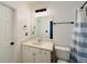 Bathroom featuring a vanity, toilet, towel rack, and a shower with a curtain at 3784 The Great Dr, Atlanta, GA 30349