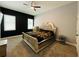 A serene bedroom with a large window, plush bed, and ample natural light creates a tranquil retreat at 3784 The Great Dr, Atlanta, GA 30349