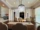 Close up of formal dining room showing coffered ceiling and stylish chandelier at 3784 The Great Dr, Atlanta, GA 30349