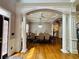 Formal dining room featuring coffered ceilings, hardwood floors, and elegant chandelier at 3784 The Great Dr, Atlanta, GA 30349