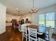Bright eat-in kitchen features a modern breakfast bar, stainless appliances, and an adjacent dining area at 3784 The Great Dr, Atlanta, GA 30349