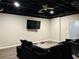 Cozy living room with a dark ceiling, large TV, and comfortable seating area at 3784 The Great Dr, Atlanta, GA 30349