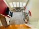 Second story view of living room with high ceiling, fireplace, and picture windows at 3784 The Great Dr, Atlanta, GA 30349