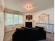 Cozy living room features a fireplace, decorative accents, large windows, and comfortable seating at 3784 The Great Dr, Atlanta, GA 30349