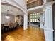 Open concept with soaring ceilings and stylish columns connecting living and dining areas at 3784 The Great Dr, Atlanta, GA 30349