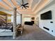 Spacious primary bedroom suite with sitting area, fireplace, tray ceiling, and abundant natural light at 3784 The Great Dr, Atlanta, GA 30349