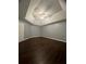 A spacious bedroom with dark wood floors and a unique tray ceiling at 3953 Cress Way Run, Decatur, GA 30034