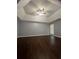 A spacious bedroom featuring dark wood floors and a ceiling fan at 3953 Cress Way Run, Decatur, GA 30034