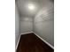 Walk-in closet with wood floors and simple shelving for storage at 3953 Cress Way Run, Decatur, GA 30034
