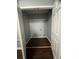 Walk in closet with dark wood flooring and built in storage shelf at 3953 Cress Way Run, Decatur, GA 30034