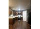 Kitchen with dark wood cabinets, stainless steel appliances and dark wood floors at 3953 Cress Way Run, Decatur, GA 30034