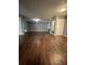 Spacious living room featuring dark wood flooring, and neutral colored walls at 3953 Cress Way Run, Decatur, GA 30034