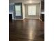Open-concept living area with wood floors and lots of natural light at 3953 Cress Way Run, Decatur, GA 30034