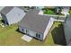Aerial view of home with roof detail, concrete patio, lush lawn, and tidy landscaping at 803 Levi Farms Ln, Canton, GA 30115