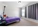 Bright bedroom with a unicorn themed bed, and an abundance of natural light from the window at 803 Levi Farms Ln, Canton, GA 30115