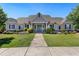 Charming community clubhouse with stone and siding exterior, well-manicured lawn and inviting blue doors at 803 Levi Farms Ln, Canton, GA 30115