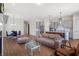 Open-concept living room with a dining area and a modern kitchen with stainless steel appliances at 803 Levi Farms Ln, Canton, GA 30115