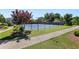 A lovely view of the community tennis courts surrounded by lush landscaping with a paved path leading to them at 803 Levi Farms Ln, Canton, GA 30115