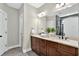 Bathroom with double vanity, granite countertops, and large mirror reflecting the shower and toilet areas at 10 Berryhill Se Pl, Cartersville, GA 30121