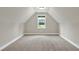 Unfurnished bonus room with window offering backyard view, neutral paint and carpet at 10 Berryhill Se Pl, Cartersville, GA 30121