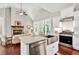 Open concept kitchen with stainless steel appliances, white cabinetry, granite countertops, and a gas range at 10 Berryhill Se Pl, Cartersville, GA 30121