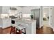 Kitchen featuring white cabinets, stainless steel appliances, and bar stool seating at 10 Berryhill Se Pl, Cartersville, GA 30121