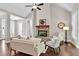 Bright living room with vaulted ceilings and a stone fireplace at 10 Berryhill Se Pl, Cartersville, GA 30121