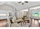 Open concept living space featuring hardwood floors, white kitchen, and lots of natural light at 10 Berryhill Se Pl, Cartersville, GA 30121