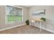 Office area with desk, chair, painting, and window providing natural light at 10 Berryhill Se Pl, Cartersville, GA 30121