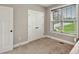 Office with window and blinds, closet, and desk with chair at 10 Berryhill Se Pl, Cartersville, GA 30121