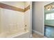 Bright white bathroom with tiled shower/tub combo at 1034 Sandy Ridge Rd, Mcdonough, GA 30252