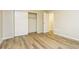 Bedroom with hardwood floors and a closet with sliding doors at 1034 Sandy Ridge Rd, Mcdonough, GA 30252
