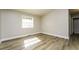 Bright bedroom with hardwood floors and a window at 1034 Sandy Ridge Rd, Mcdonough, GA 30252
