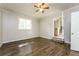 Neutral bedroom featuring a ceiling fan, natural light, and hardwood floors at 1034 Sandy Ridge Rd, Mcdonough, GA 30252